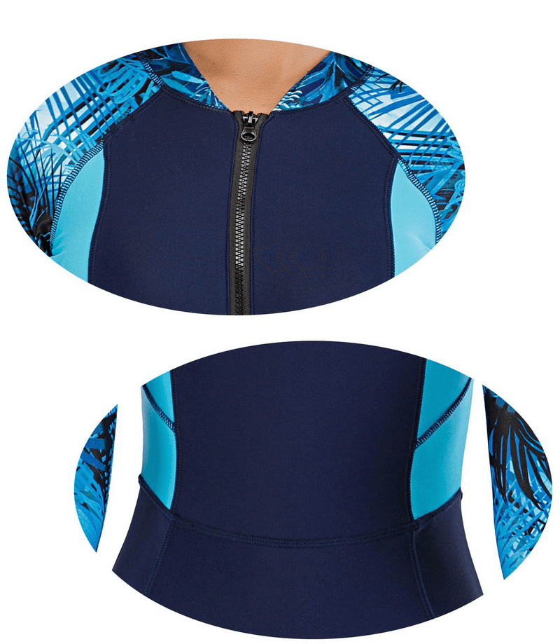Women's zipper rash guard swimsuit with long sleeves and blue patchwork design, showcasing stylish neckline and waist details.
